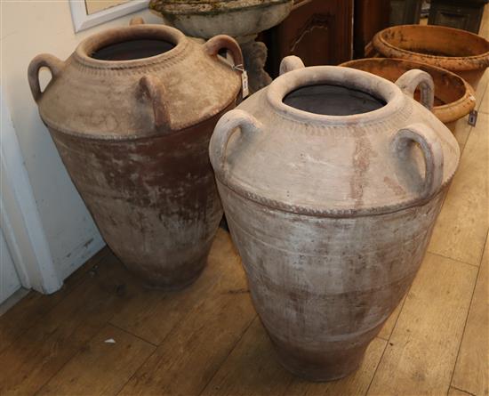 A pair of terracotta amphora H.78cm